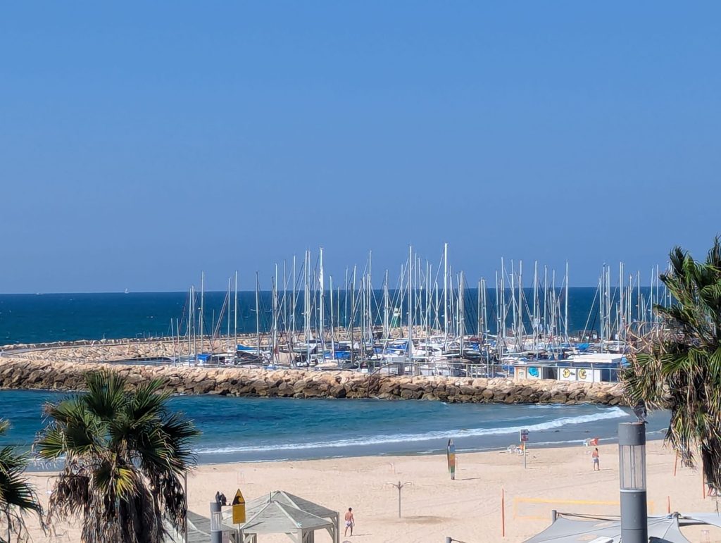 boats in the sea by frishman beach