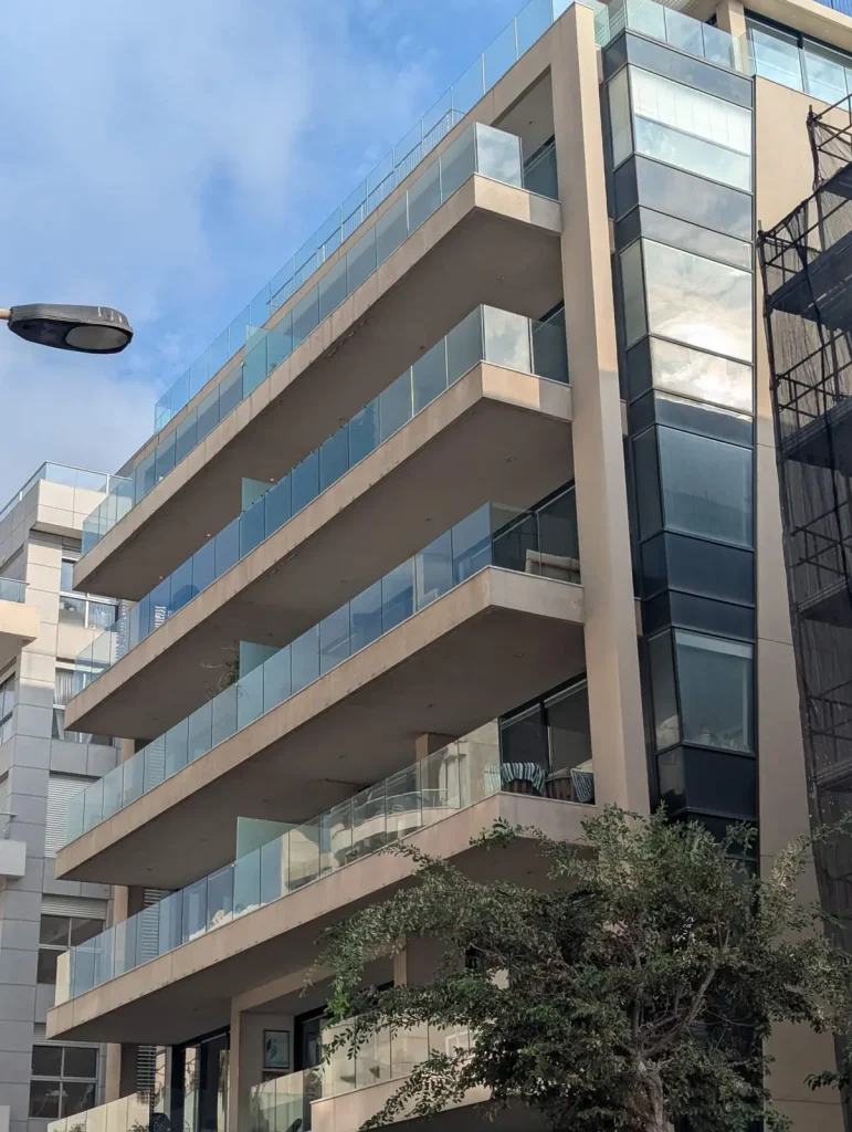 Apartment building with glass balconies near Gordon Beach, Tel Aviv