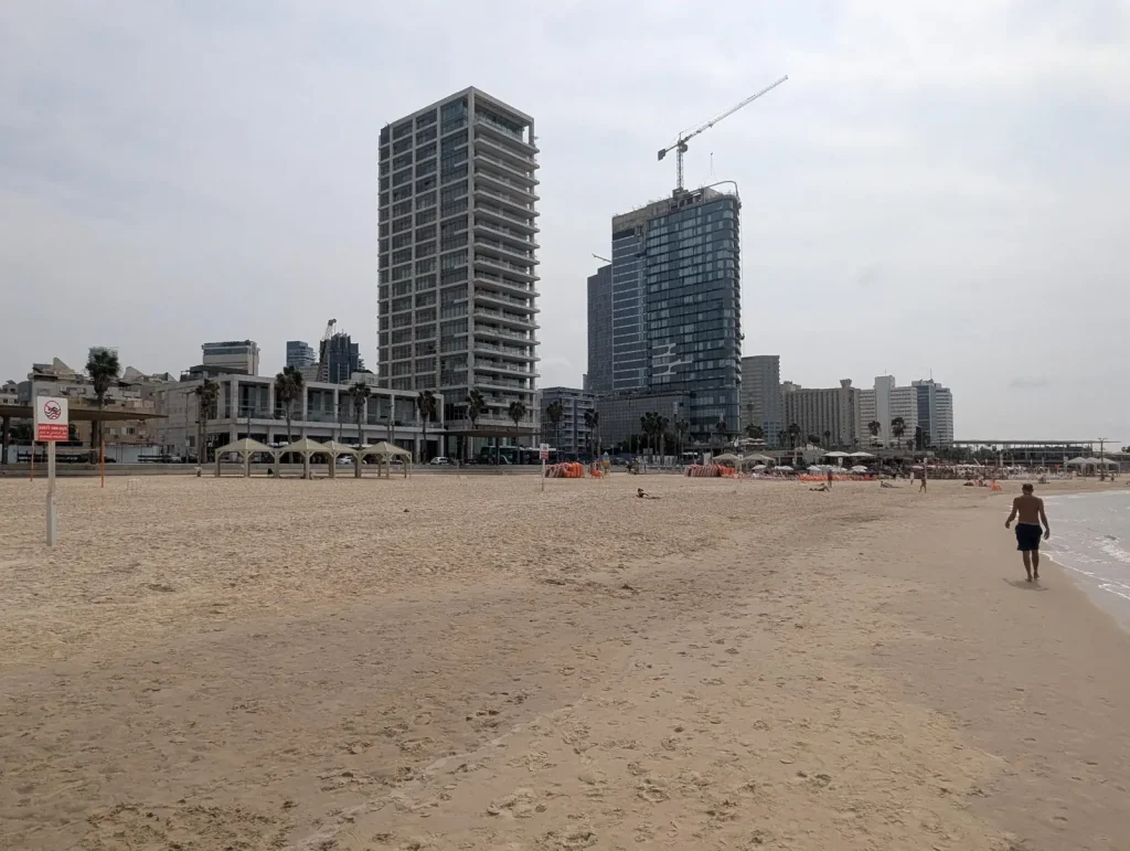Wide sand at Banana Beach looking north toward the hotel towers