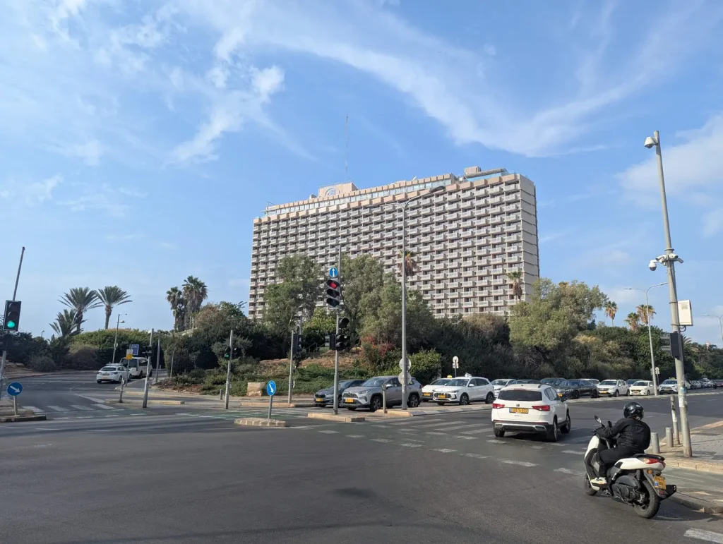 Hilton Tel Aviv hotel rising above the trees of Independence Park