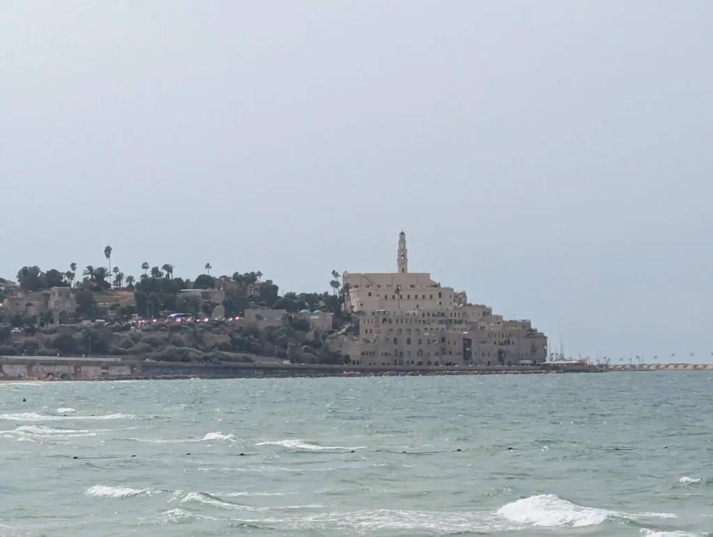Old Jaffa and St. Peter's Church seen across the water from Charles Clore Beach