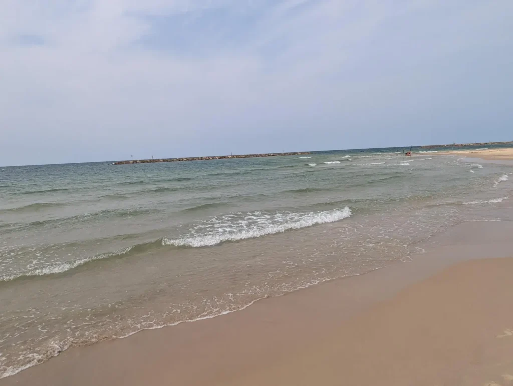 Small waves along the shoreline at a Tel Aviv beach