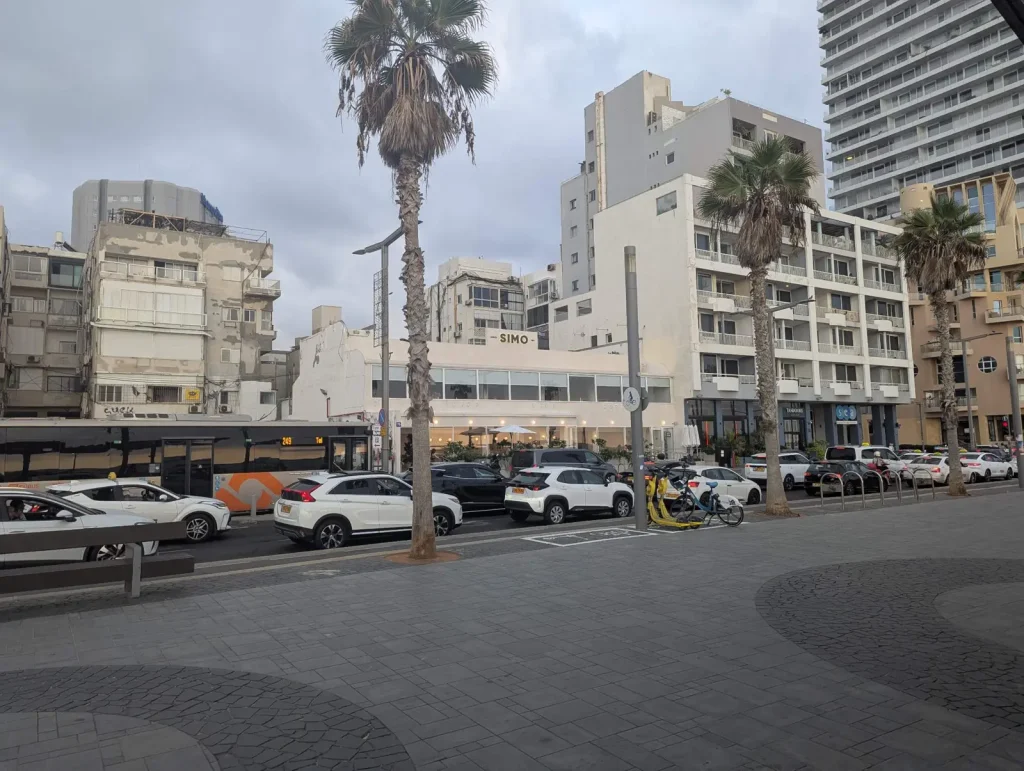 Seafront street with the SIMO restaurant and hotels behind