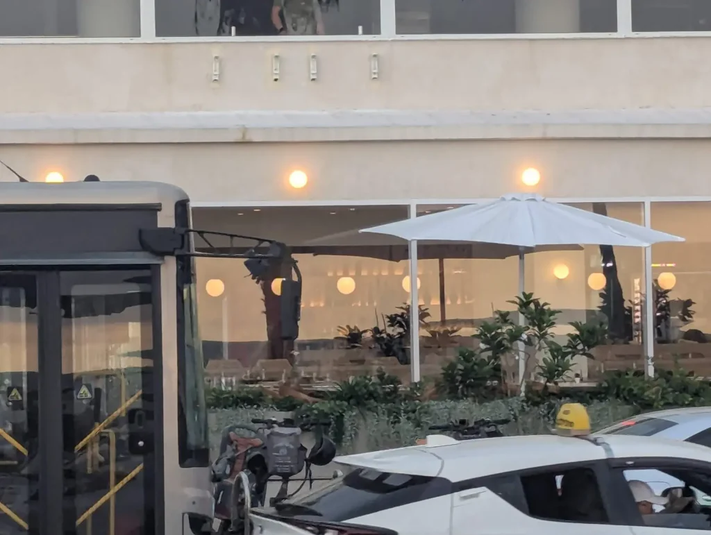 SIMO restaurant glass front with an umbrella terrace