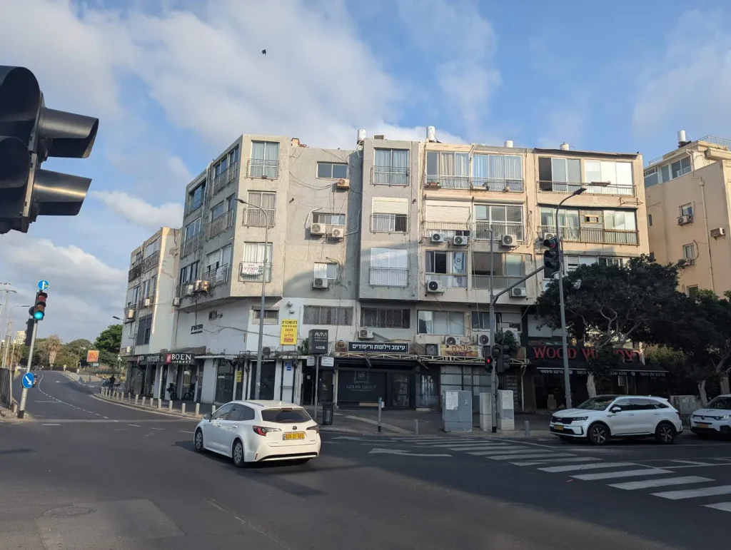 Street corner with older apartment blocks near the Tel Aviv Port