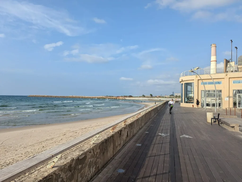 Port boardwalk deck beside the beach with the Reading chimney in the distance