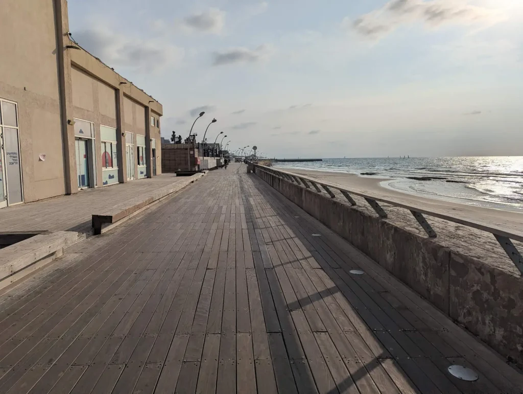Wooden deck boardwalk at the Tel Aviv Port running along the sea